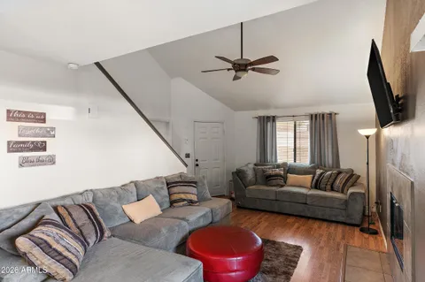 a living room with furniture and a flat screen tv