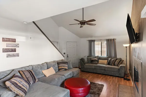 a living room with furniture and a flat screen tv