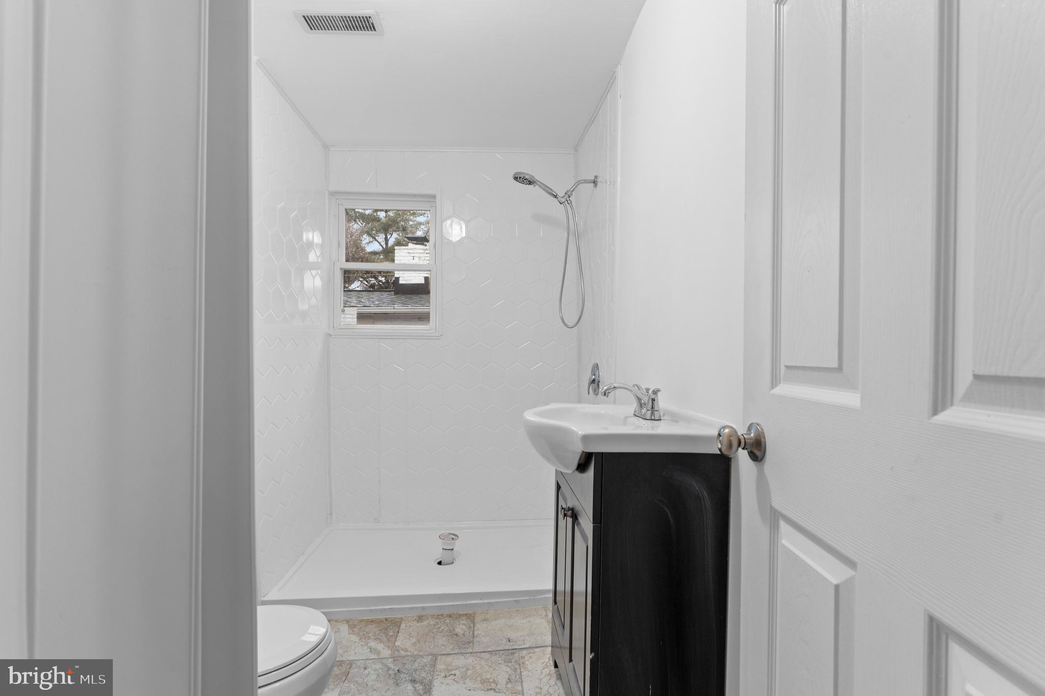 1504 Taylor Avenue, Unit B Parkville, MD 21234 - Photo 11 of 20 a bathroom with a sink and mirror