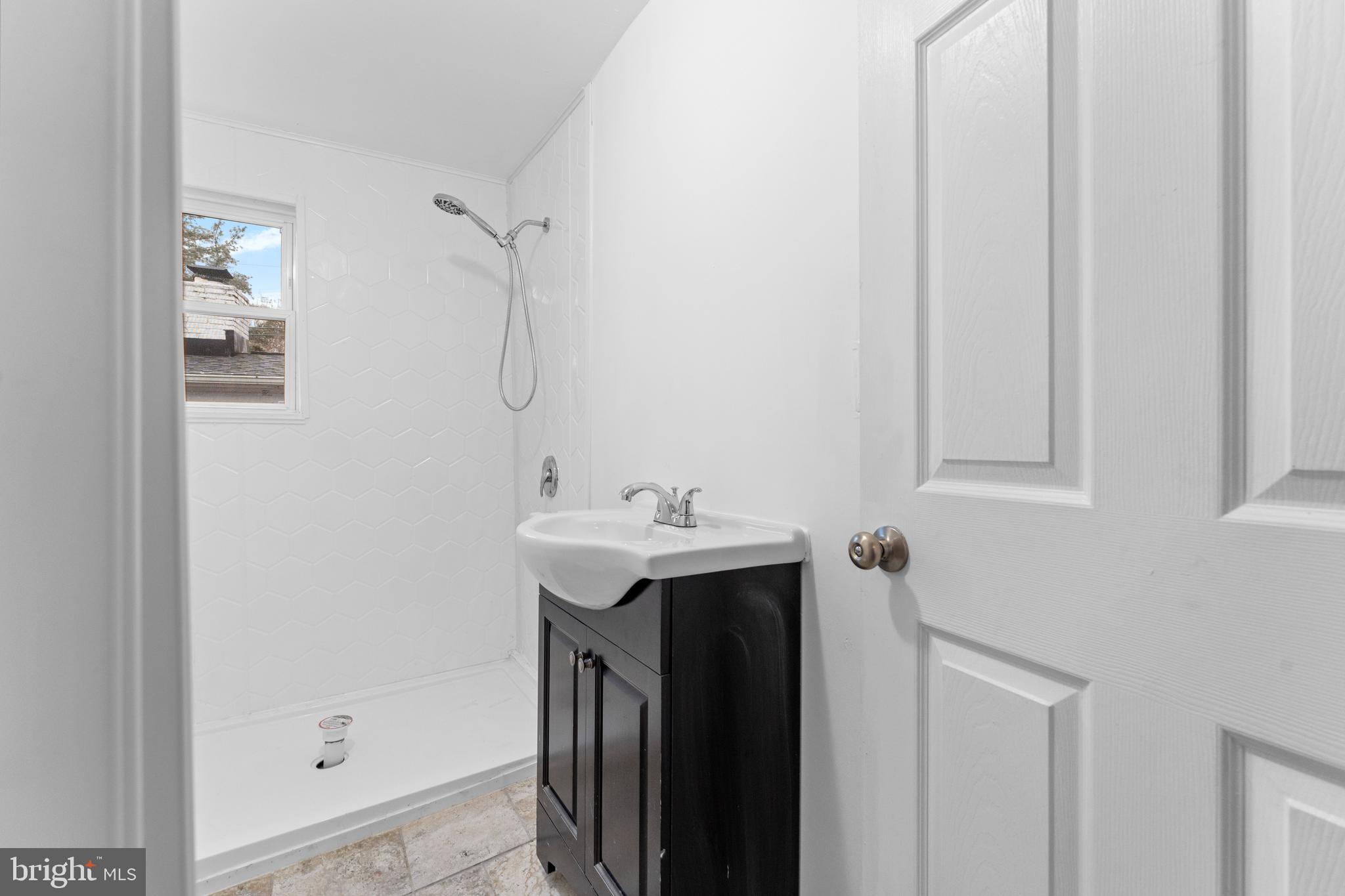 1504 Taylor Avenue, Unit B Parkville, MD 21234 - Photo 13 of 20 a bathroom with a sink and mirror