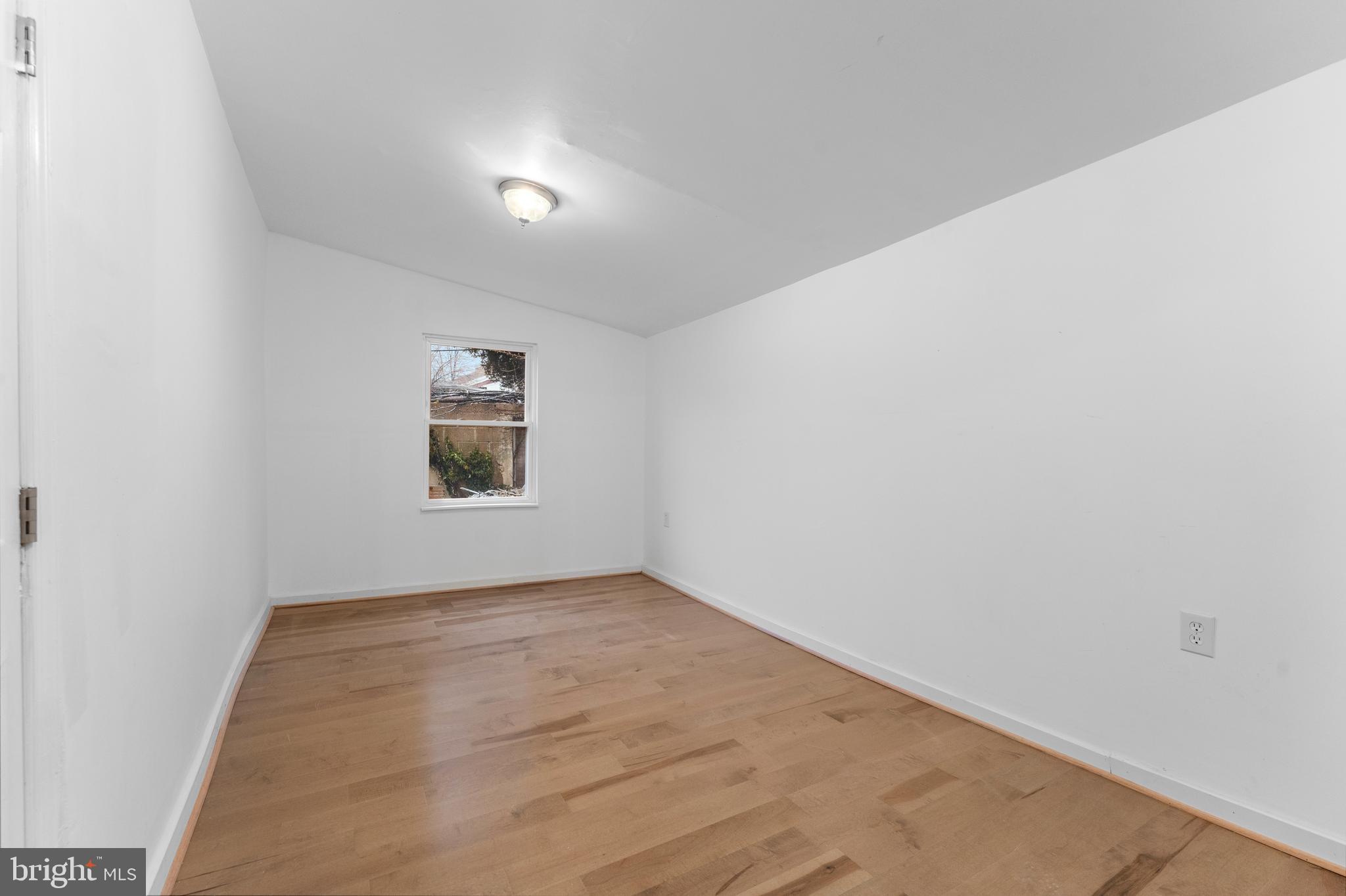 1504 Taylor Avenue, Unit B Parkville, MD 21234 - Photo 15 of 20 an empty room with a window