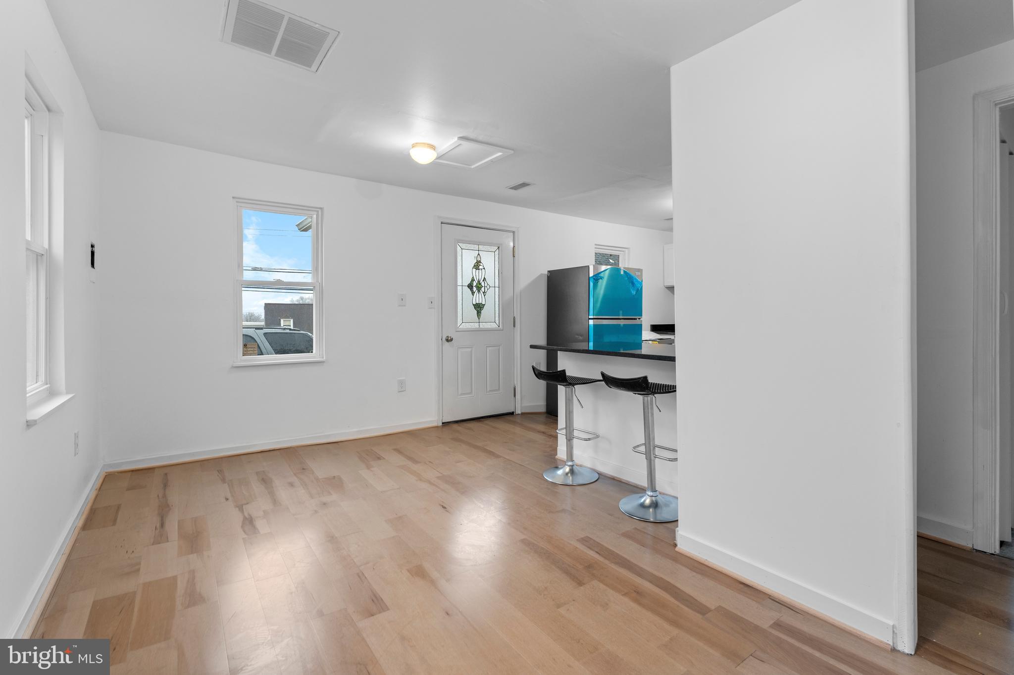 1504 Taylor Avenue, Unit B Parkville, MD 21234 - Photo 9 of 20 wooden floor in an empty room with a window