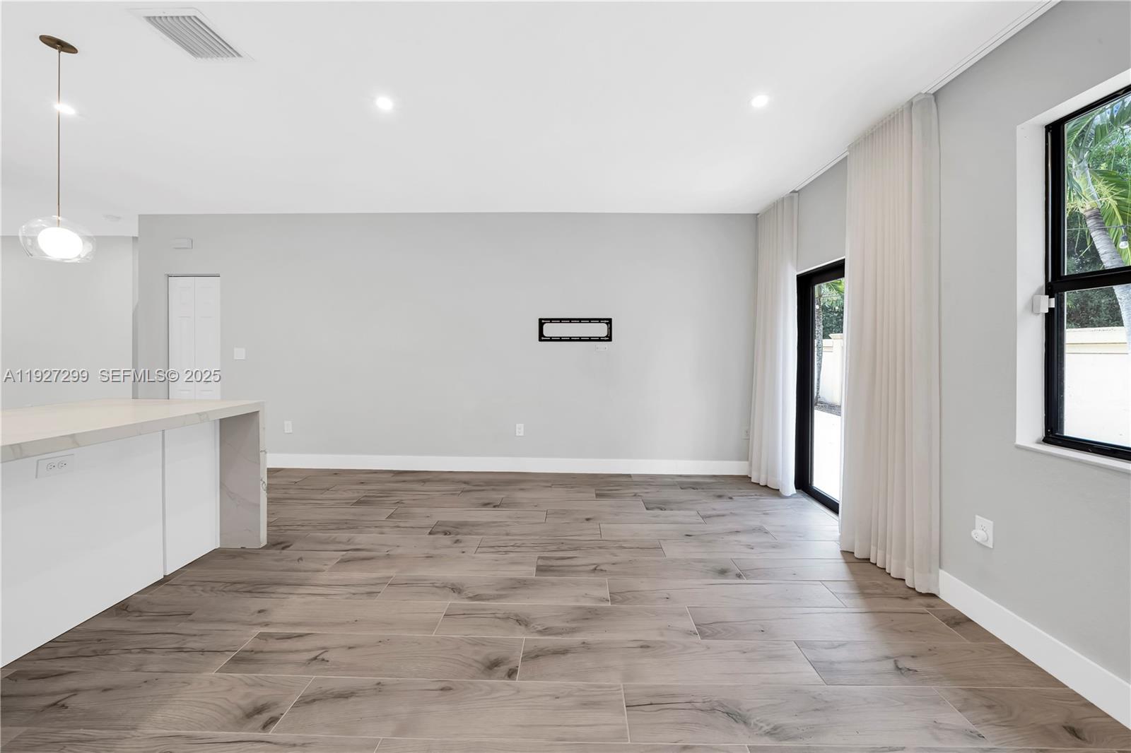 11448 Southwest 151st Path Miami, FL 33196 - Photo 29 of 35 a view of a kitchen with a sink and dishwasher with wooden floor