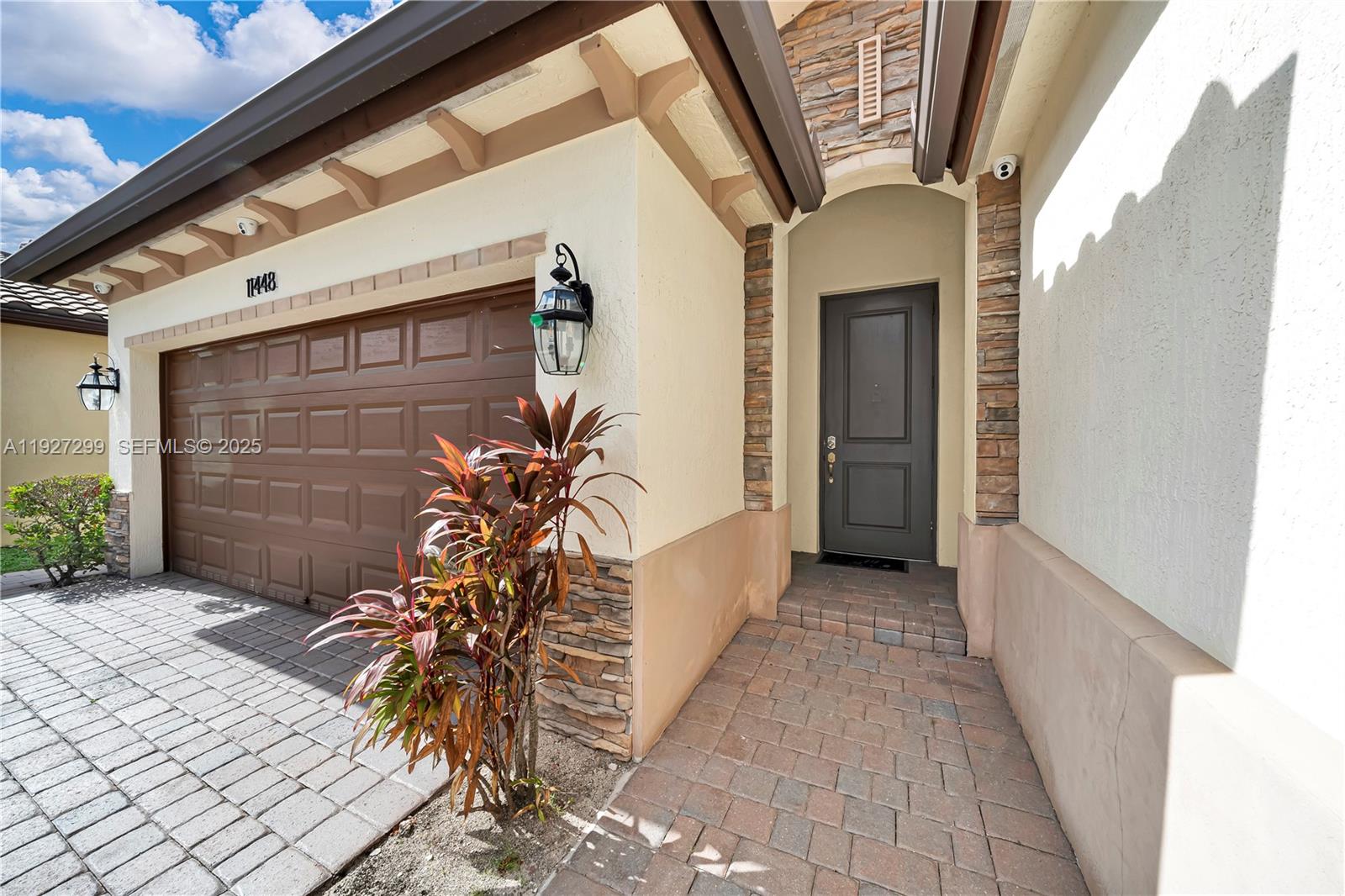 11448 Southwest 151st Path Miami, FL 33196 - Photo 4 of 35 a view of the house with a yard