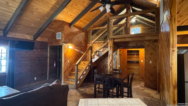 a view of a patio with a table and chairs