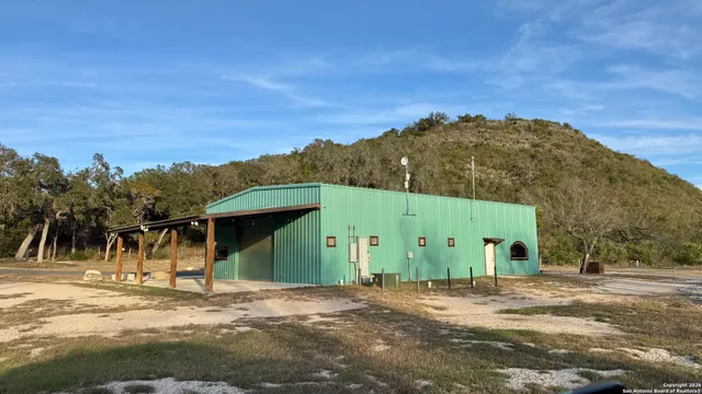 a view of a large building with a mountain in the background