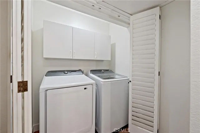 a bathroom with double vanity sinks and a mirror