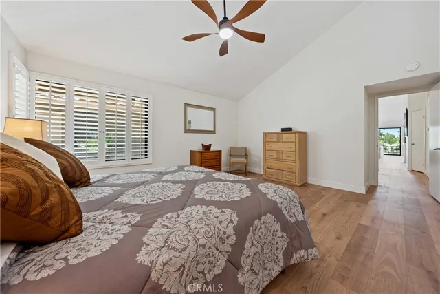 a view of a house with a big yard and sitting area