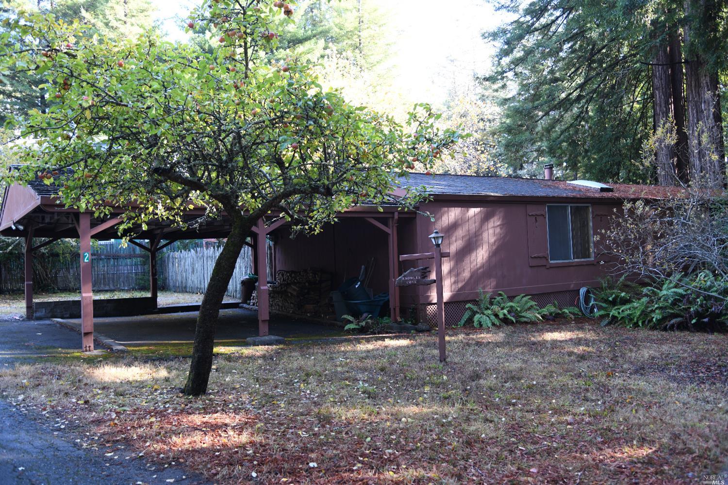 46600 Old Stage Road, Unit 2 Gualala, CA 95445 - Photo 1 of 1 a front view of a house with garden