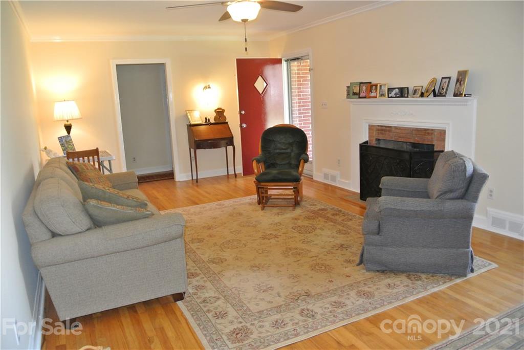 173 Tanner Street Rutherfordton, NC 28139 - Photo 4 of 25 a living room with furniture and a fireplace