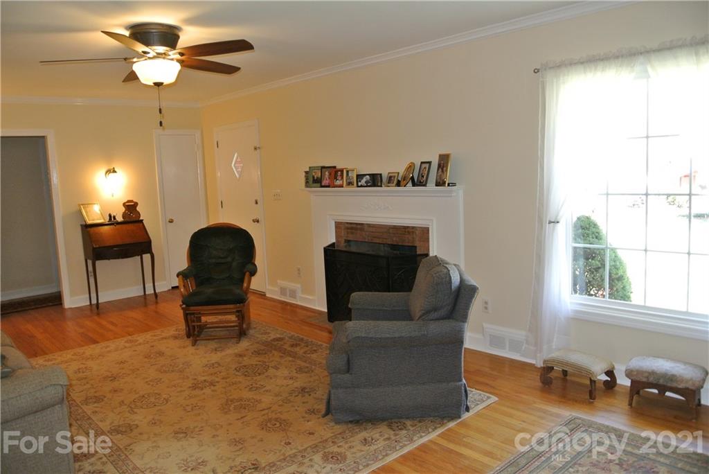 173 Tanner Street Rutherfordton, NC 28139 - Photo 6 of 25 a living room with furniture and a fireplace