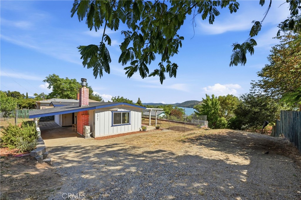 13701 Arrowhead Road Clearlake, CA 95422 - Photo 1 of 21 Carport and front patio facing the lake