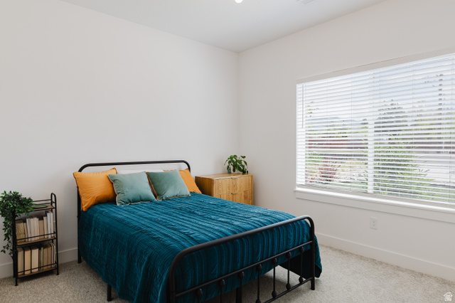 287 East 1000 North Logan, UT 84321 - Photo 28 of 41 Spacious interior room featuring light-colored walls and soft carpet flooring