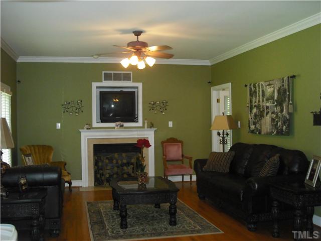 6836 Cool Pond Road Raleigh, NC 27613 - Photo 2 of 12 a living room with furniture and a fireplace