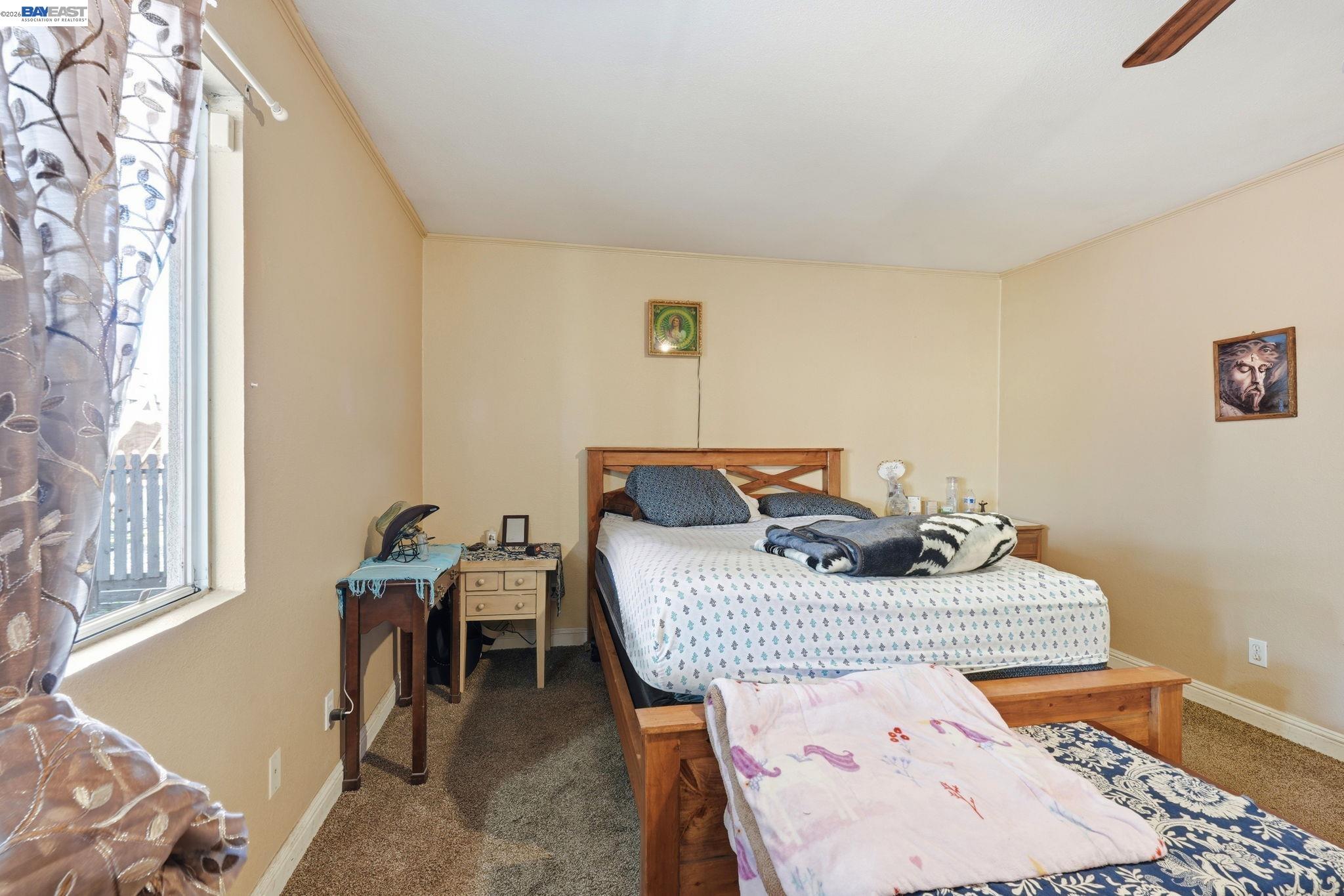 10378 South Priest Road French Camp, CA 95231 - Photo 17 of 44 a bedroom with a bed and window