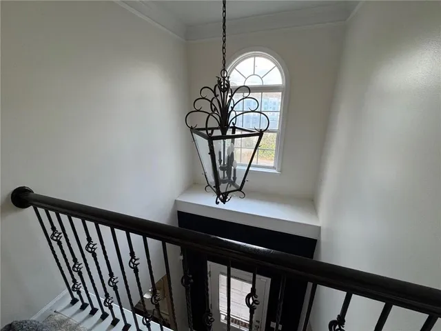 a view of a hallway with a chandelier