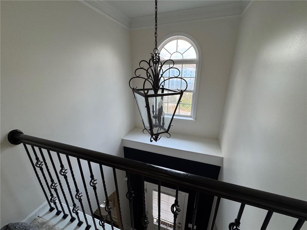 524 King Street Suwanee, GA 30024 - Photo 11 of 23 a view of a hallway with a chandelier