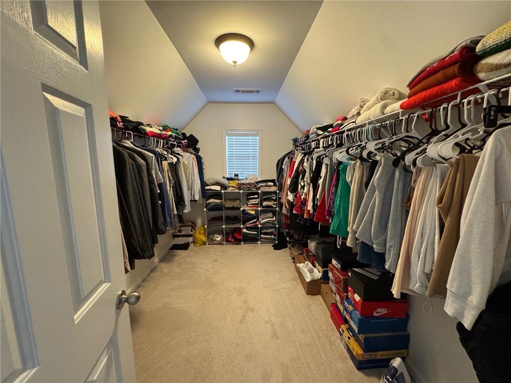 524 King Street Suwanee, GA 30024 - Photo 13 of 23 walk in closet with clothes and shoes