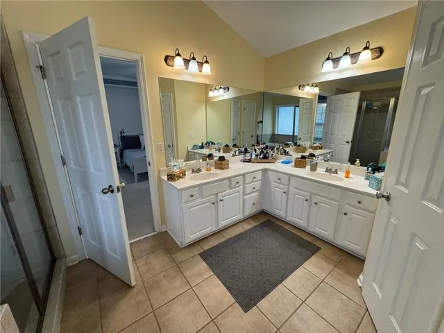 a kitchen with a sink cabinets and window