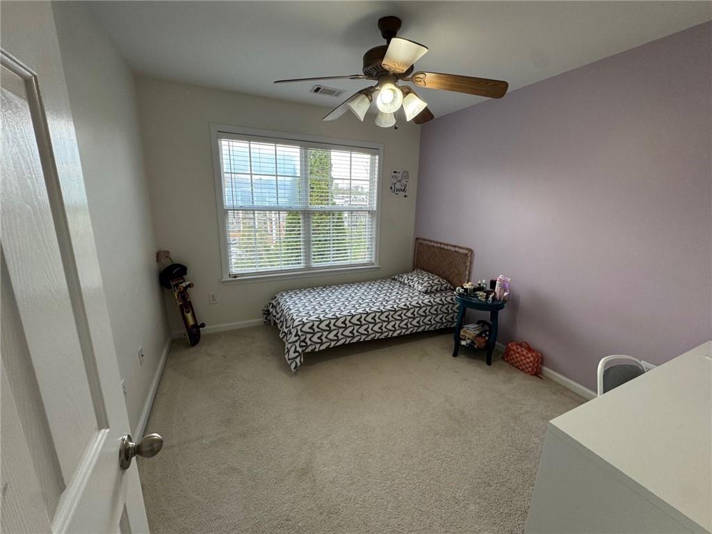 524 King Street Suwanee, GA 30024 - Photo 18 of 23 a bedroom with a bed and a window