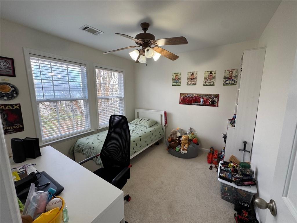 524 King Street Suwanee, GA 30024 - Photo 19 of 23 a bedroom with furniture and a window
