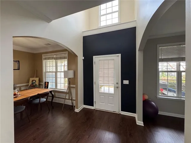 a bedroom with furniture and a wooden floor