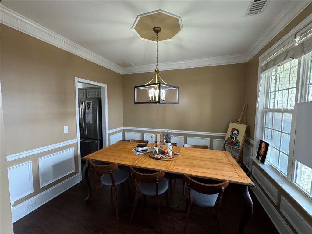 524 King Street Suwanee, GA 30024 - Photo 3 of 23 a view of a dining room with a table and chairs