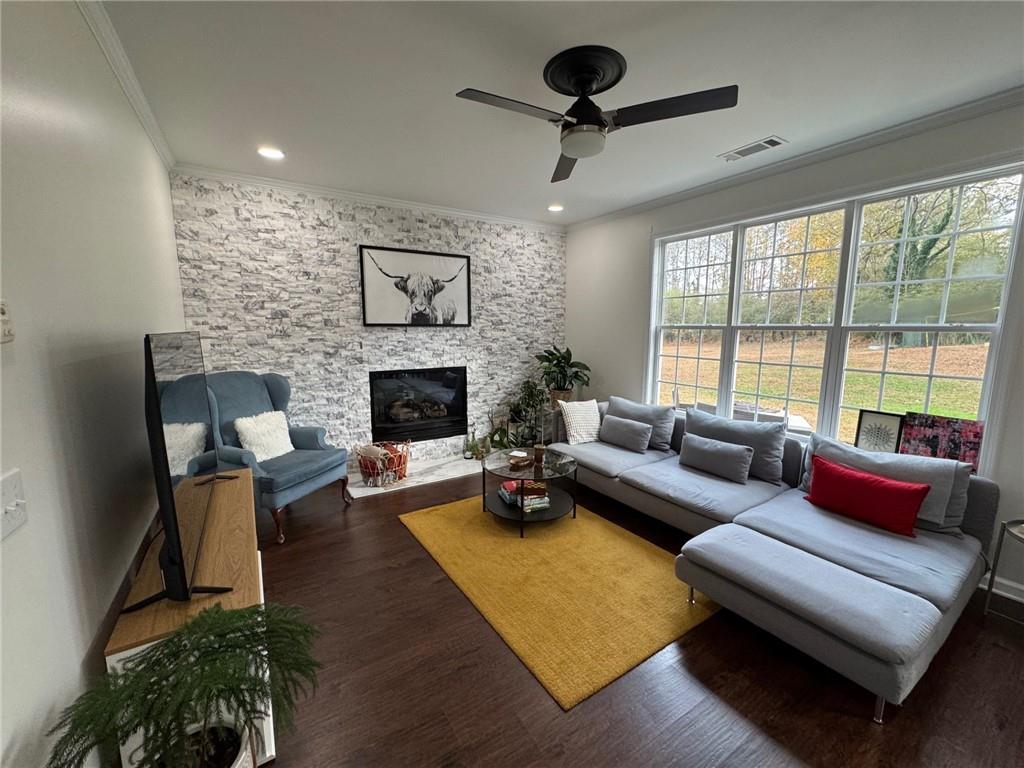 524 King Street Suwanee, GA 30024 - Photo 5 of 23 a living room with furniture and a fireplace