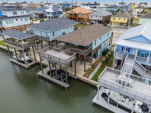 an aerial view of a houses with yard