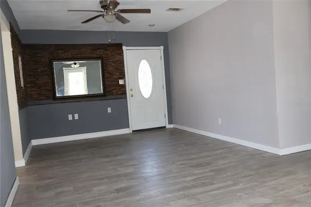 a view of an empty room with a window