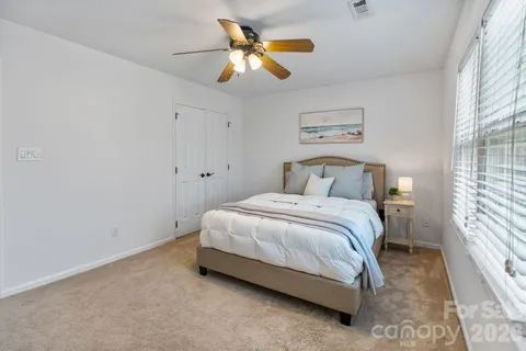 a view of a big room with windows and cabinet