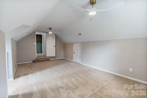 a kitchen with a white stove and cabinets