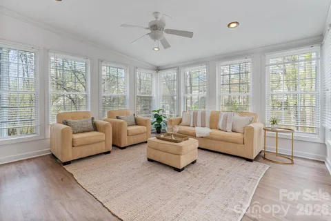 a living room with furniture and windows