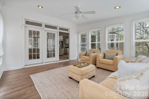 a living room with furniture and windows