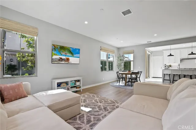 a view of a dining room with furniture and window