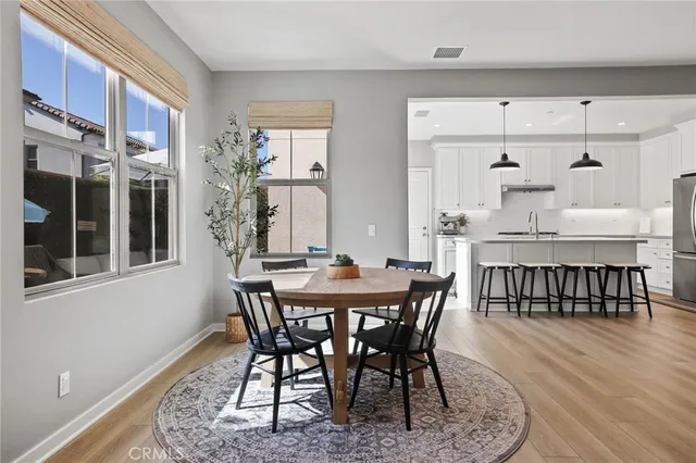 a living room with furniture a window and a chandelier