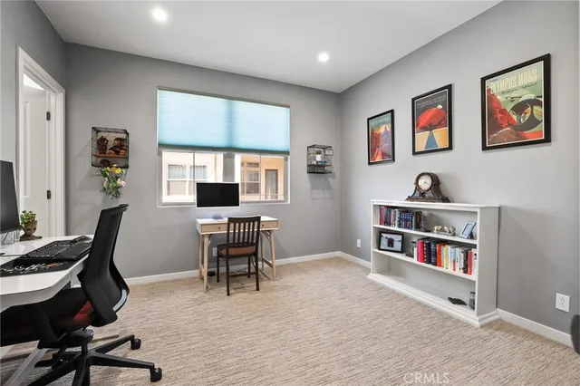 a bedroom with furniture and a window