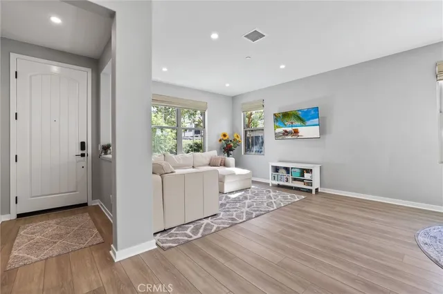 a living room with furniture and a table