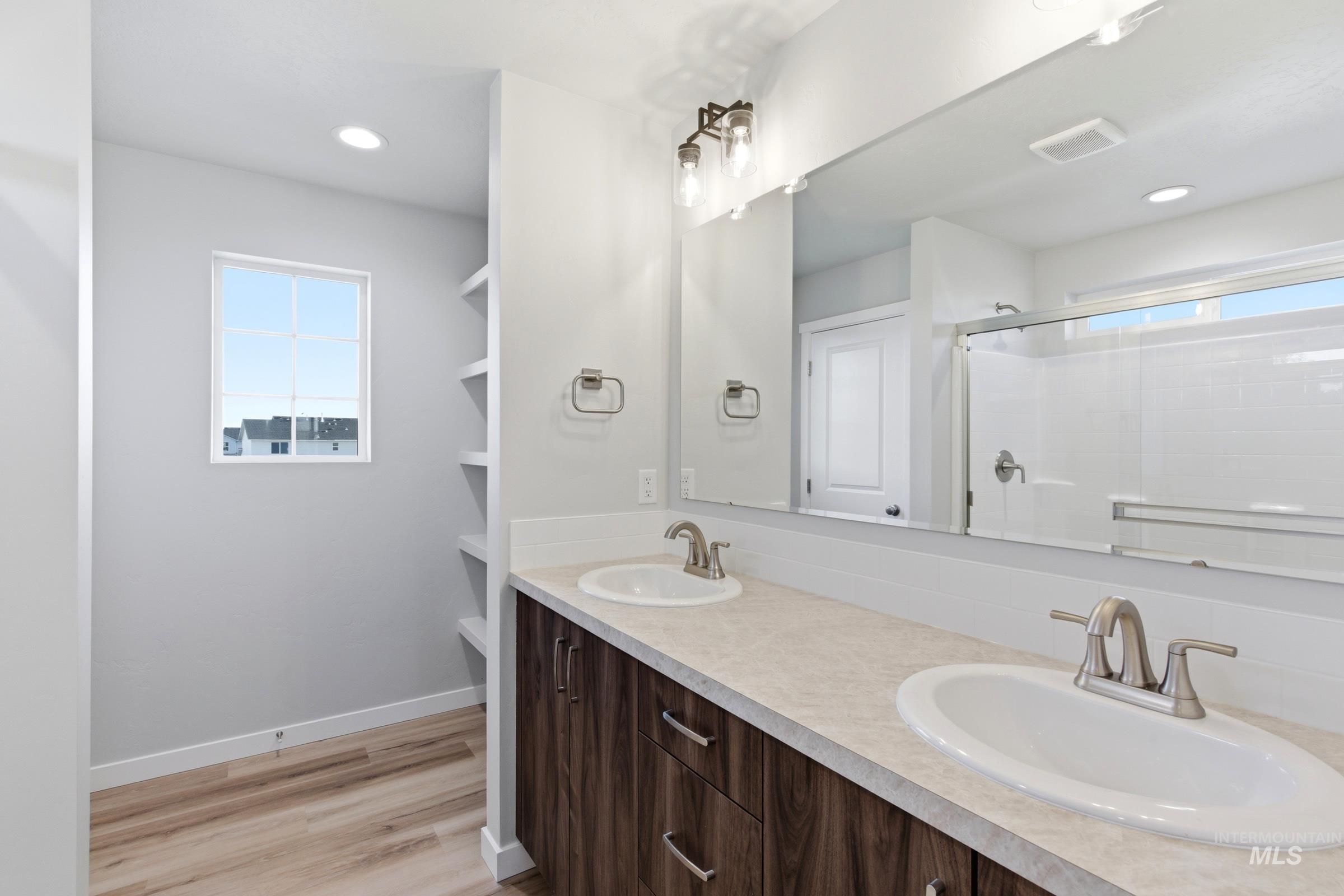 13709 Redway Court Caldwell, ID 83607 - Photo 21 of 28 Dual vanity with undermount sinks and brushed nickel fixtures
