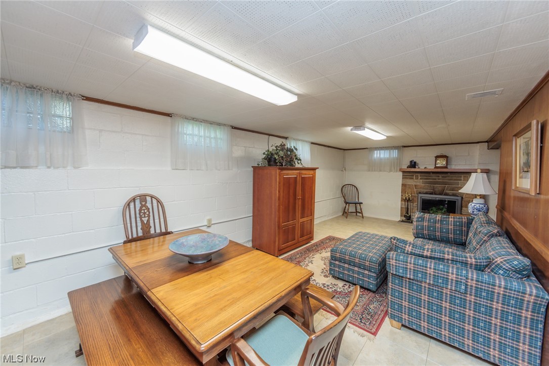 26585 Cook Road Olmsted Falls, OH 44138 - Photo 21 of 34 Basement rec room with a lovely stone fireplace