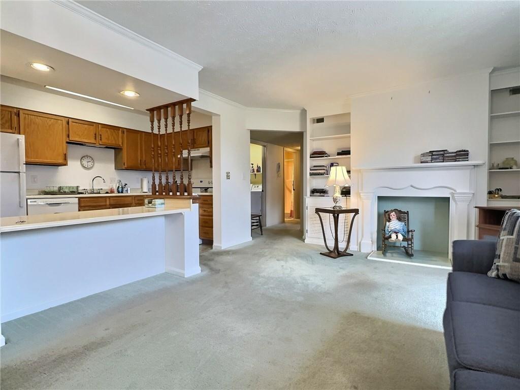 830 South Main Street, Unit 206 Washington, PA 15301 - Photo 11 of 19 a living room with furniture and a fireplace