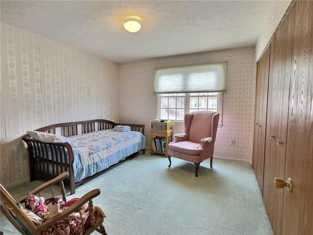 830 South Main Street, Unit 206 Washington, PA 15301 - Photo 14 of 19 a spacious bedroom with a bed and a window