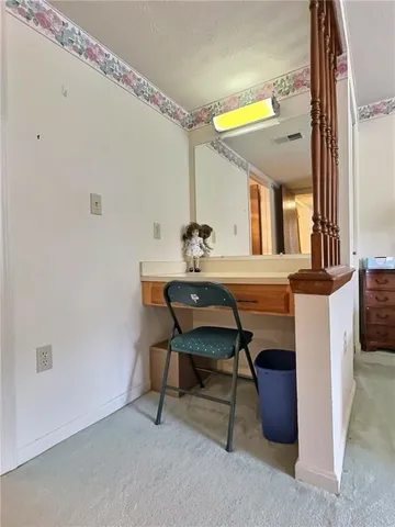 a dining room with a table and chairs