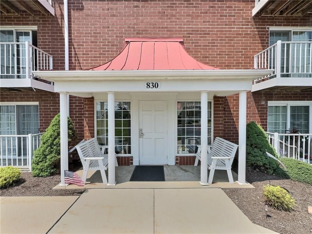 830 South Main Street, Unit 206 Washington, PA 15301 - Photo 2 of 19 a front view of a house with garden and seating area
