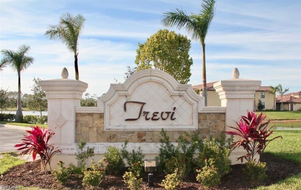 9560 Trevi Court, Unit 4816 Naples, FL 34113 - Photo 31 of 31 a sign that is sitting in front of flowers