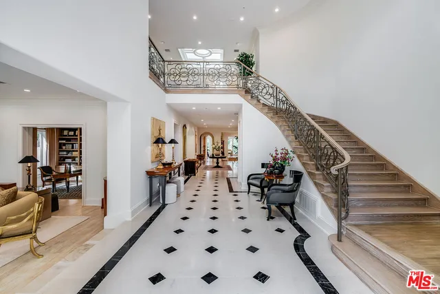 a view of a hallway with living room