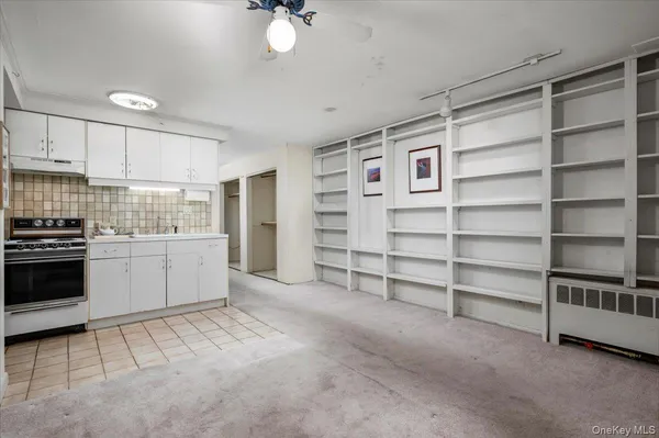 a kitchen with a cabinets and a stove