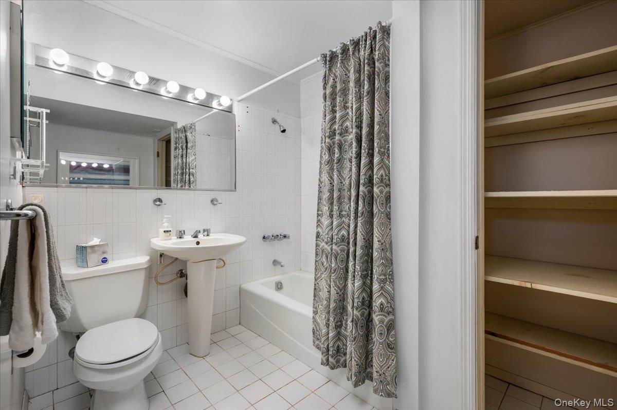 580 Bedford Road, Unit 8 Pleasantville, NY 10570 - Photo 13 of 35 a bathroom with a sink toilet and shower