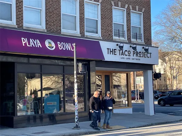 a outdoor space with a table and chairs