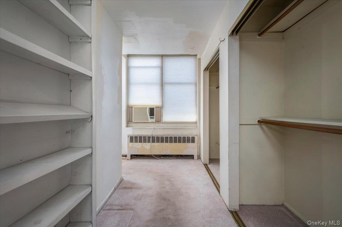 580 Bedford Road, Unit 8 Pleasantville, NY 10570 - Photo 5 of 35 a view of room with cabinet and mirror